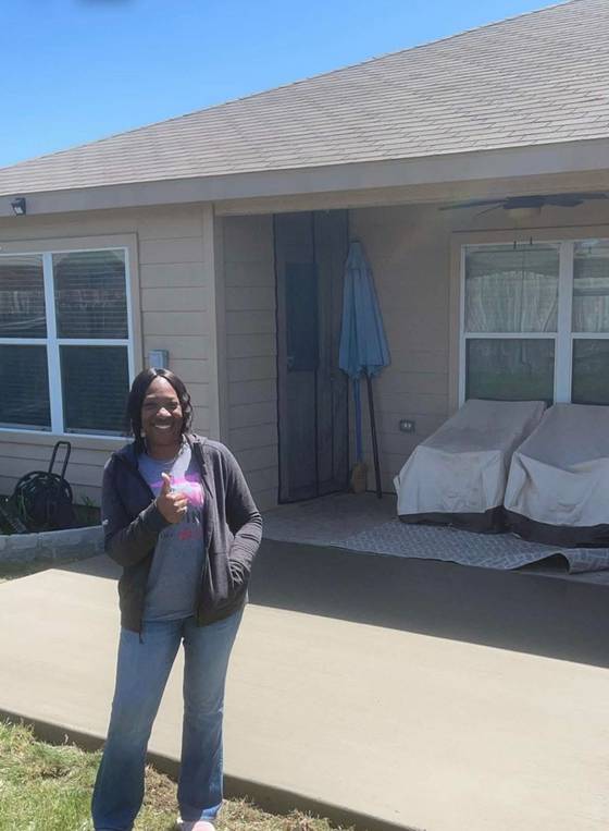 Satisfied customer with covered patio slab